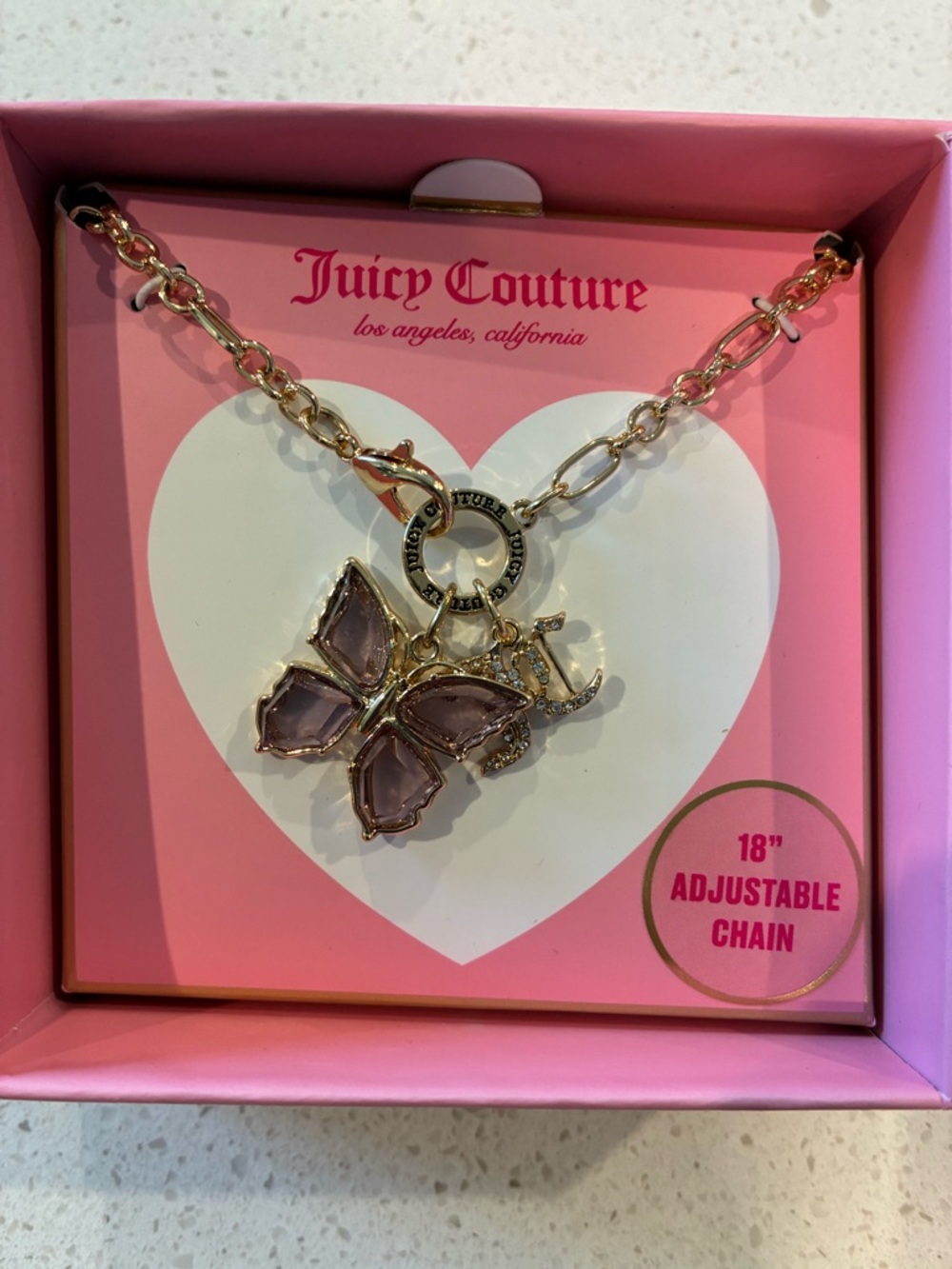 Juicy Couture Gold Tone Necklace with Pink Butterfly and JC Pendants